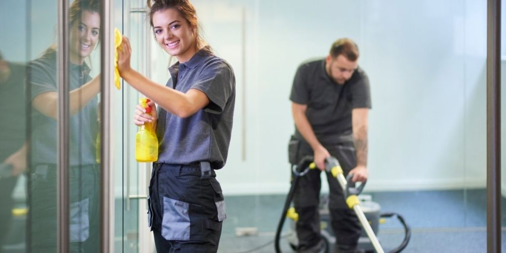 two people cleaning an office